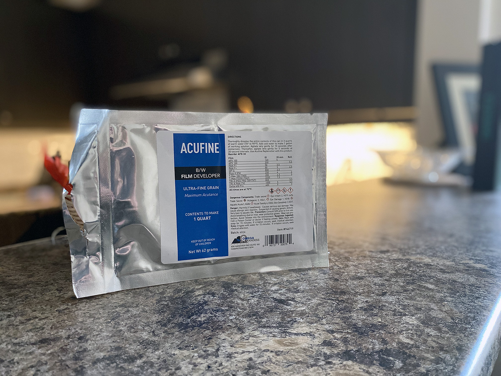 Silver Foil Pouch with Blue and White Label stating it contains the powder to make Acufine developer.